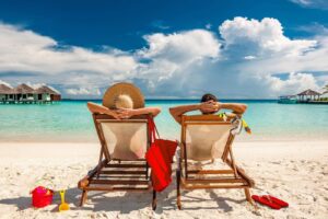 couple on a beach holiday Employee benefits scheme